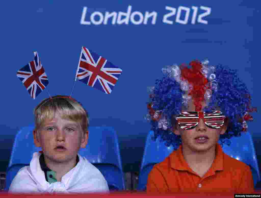 Young spectators watch the men's -81kg and women's 63kg judo competition at the London 2012 Olympic Games July 31, 2012.