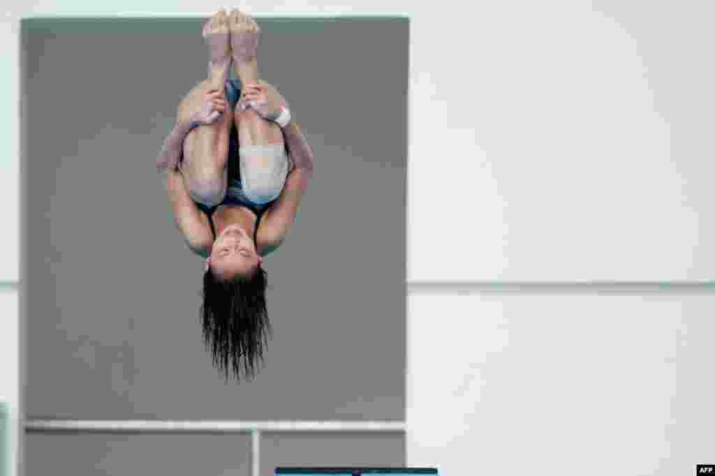Singapore's Fong Kay Yian competes during the women's three-meter springboard diving event at the 27th SEA Games in Naypyidaw, Burma.