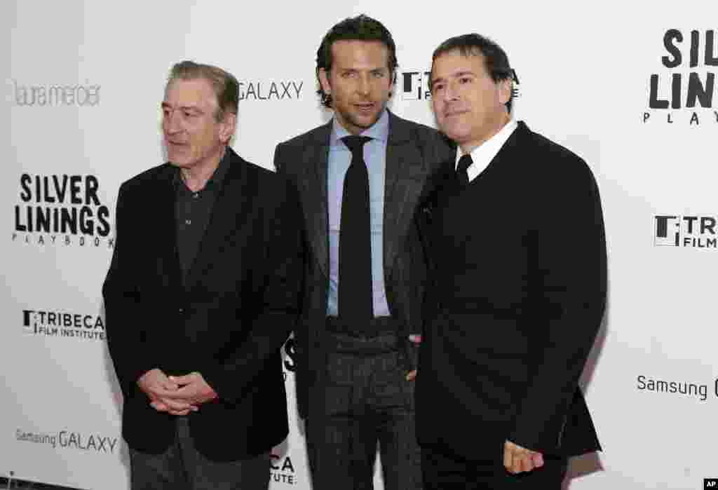 Actors Robert DeNiro, left, Bradley Cooper, and Director David O. Russell, right, attend the premiere of "Silver Linings Playbook," at the Ziegfeld Theatre in New York, November 12, 2012.