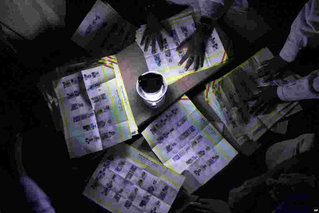Election workers count votes at a station that reported a high voter turnout in Kidal, Mali, July 28, 2013. 