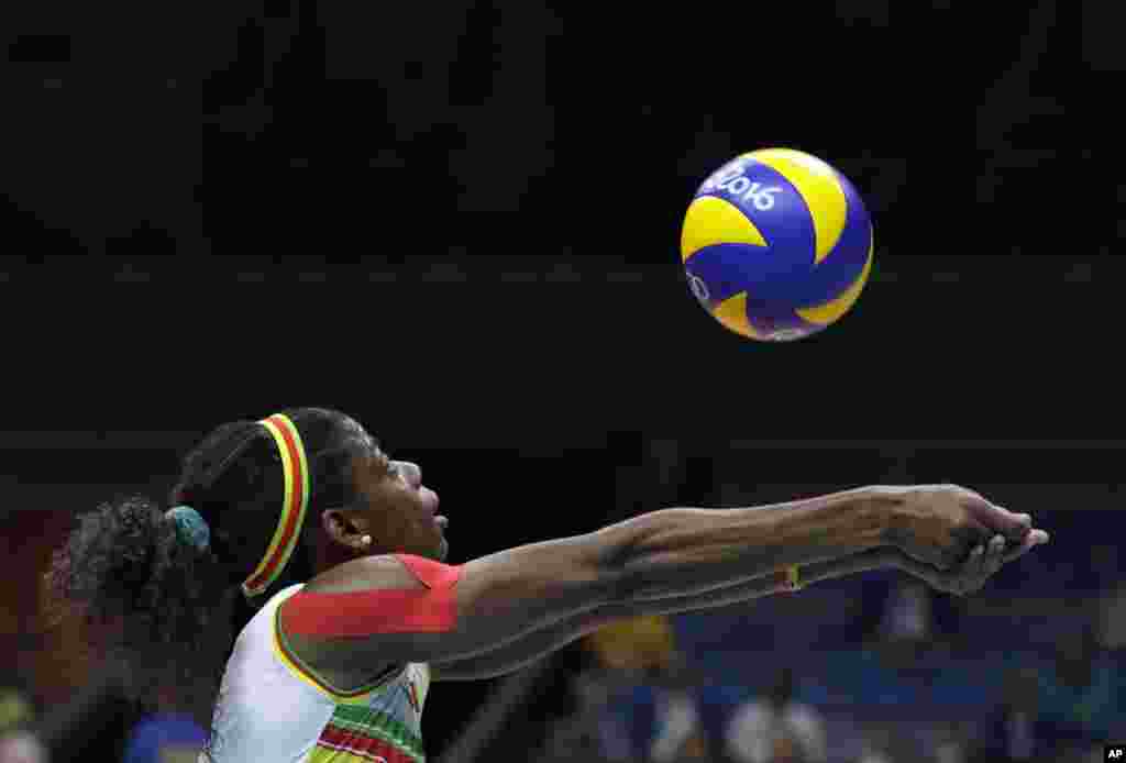 Cameroon's Stephanie Fotso Mogoung bumps during a women's preliminary volleyball match against Brazil at the 2016 Summer Olympics in Rio de Janeiro, Brazil, Aug. 6, 2016.