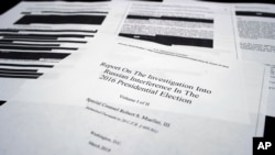 Four pages of special counsel Robert Mueller report on the witness table in the House Intelligence Committee hearing room on Capitol Hill, in Washington, April 18, 2019.