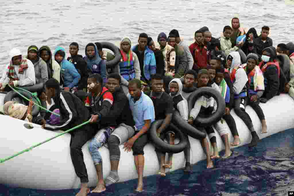 Illegal migrants are brought to shore after being intercepted by the Libyan coast guard on the Mediterranean Sea, in Garaboli Libya.