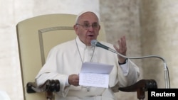Pope Francis speaks as he leads the weekly audience in Saint Peter's square at the Vatican, Oct. 14, 2015. 