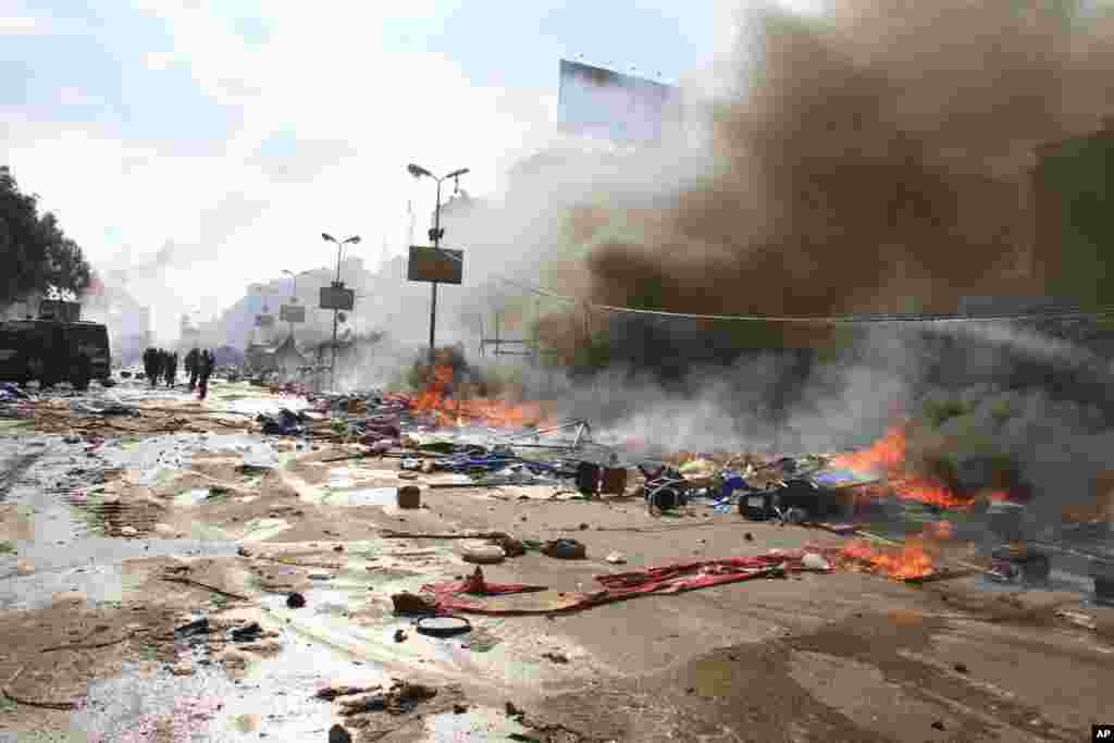 Fires burn as Egyptian security forces clear a sit-in by supporters of ousted Islamist President Mohammed Morsi in the eastern Nasr City district of Cairo, Egypt, Aug. 14, 2013. 