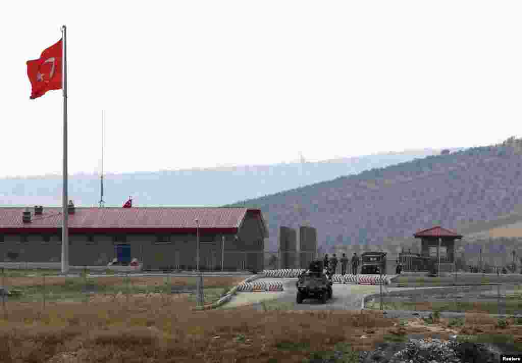 A Turkish armored personnel carrier drives out of a military border post on the Turkish-Syrian border near the village of Hacipasa in Hatay province, southern Turkey, October 9, 2012.
