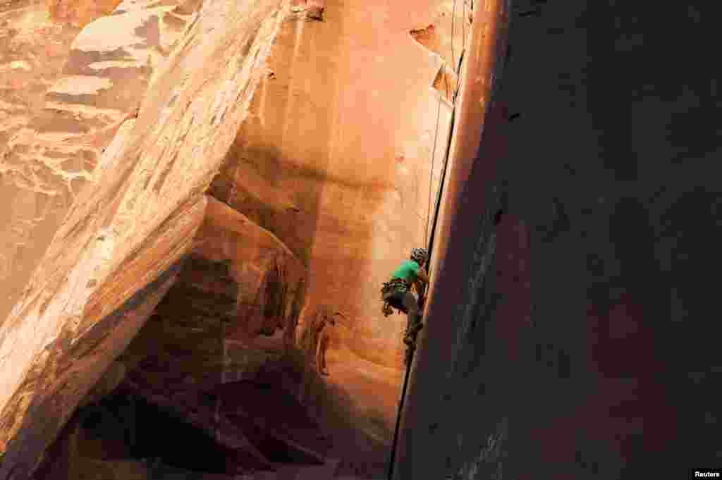 Rock climber David Rozul makes an ascent in Indian Creek, an area that attracts outdoor recreationists from around the world to Bears Ears National Monument, Utah, Oct. 29, 2017.