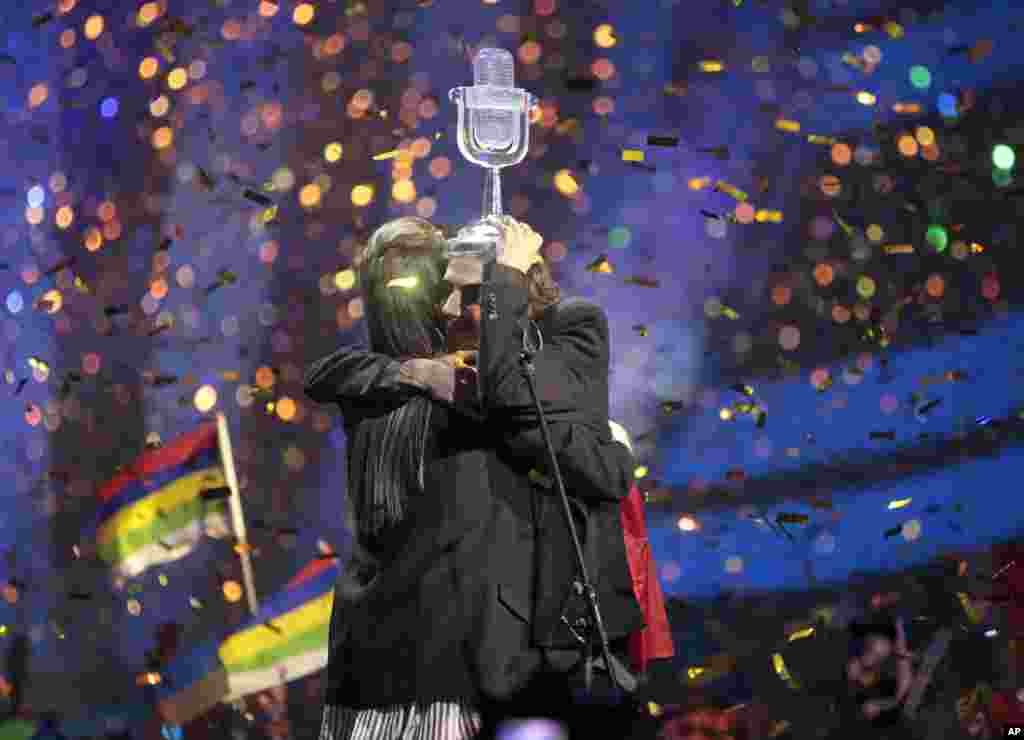 Salvador Sobral from Portugal, right, embraces his sister Luisa after performing the song "Amar pelos dois" following his win in the Final of the Eurovision Song Contest in Kyiv, Ukraine, May 13, 2017.