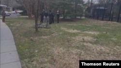 Police officers detain a man near the official residence of US Vice President Kamala Harris on the grounds of the Naval Observatory in Washington, DC, March 17, 2021, in this still image taken a social media video. (@penguinsix/via Reuters)