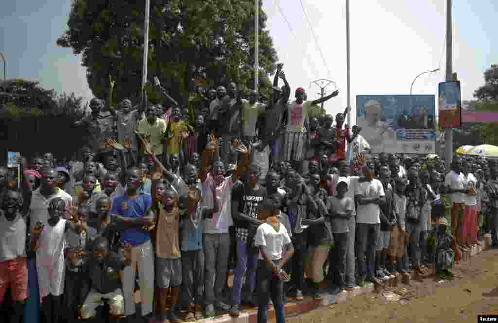People crowd the street as they wait for the arrival of Pope Francis in Bangui.