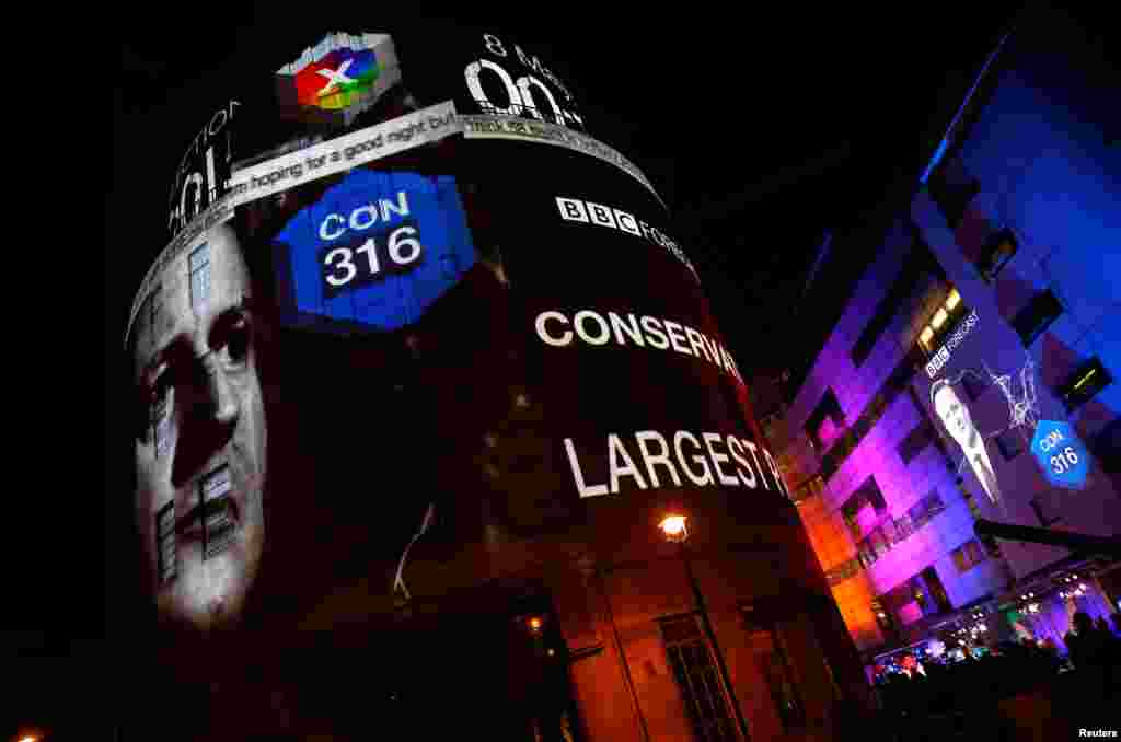 The results of exit polls are projected on to the side of Broadcasting House, the headquarters of the BBC, after voting closed in Britain's general election, in central London.