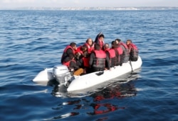 Migrants who launched from the coast of northern France cross the English Channel in an inflatable boat near Dover, Britain, Aug. 4, 2021.