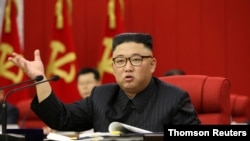 North Korean leader Kim Jong Un speaks during the opening of the 3rd Plenary Meeting of the 8th Central Committee of the Workers' Party of Korea, June 15, 2021.