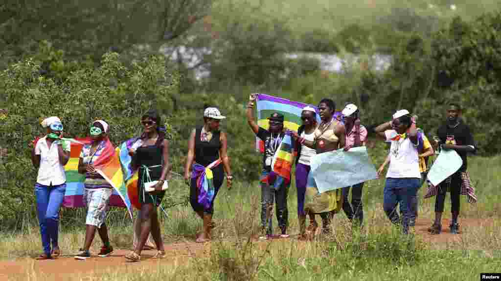 People walk in a parade as they celebrate the annulment of an anti-homosexuality law by Uganda's constitutional court in Entebbe, Aug. 9, 2014.