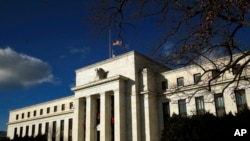 FILE - The Federal Reserve building is seen during a partial government shutdown in Washington, Dec. 24, 2018. 