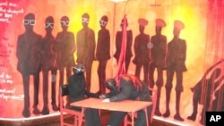 Owen Maseko's painting of the 1987 Unity Accord between Robert Mugabe (ZANU) and Joshua Nkomo (ZAPU) which brought the ZANU-PF party into existence. The painting shows a bloodied Nkomo bending over the accord, while Mugabe is the other individual seated