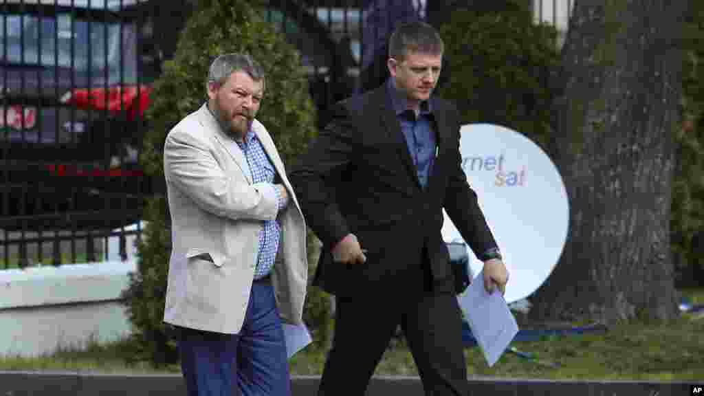 Pro-Russian rebel leaders from Eastern Ukraine Andrei Purgin, left, and Alexey Karyakin walk in Minsk, Belarus, Sept. 1, 2014.