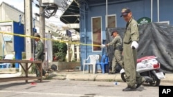 Investigators work at the scene of an explosion in the resort town of Hua Hin, 240 kilometers (150 miles) south of Bangkok, Aug. 12, 2016. 