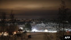 Rescue crews work at the site of a landslide and crater in Ask in Gjerdrum,on January 2, 2021, following a landslide in the town some 40 km northeast of the capital Oslo.