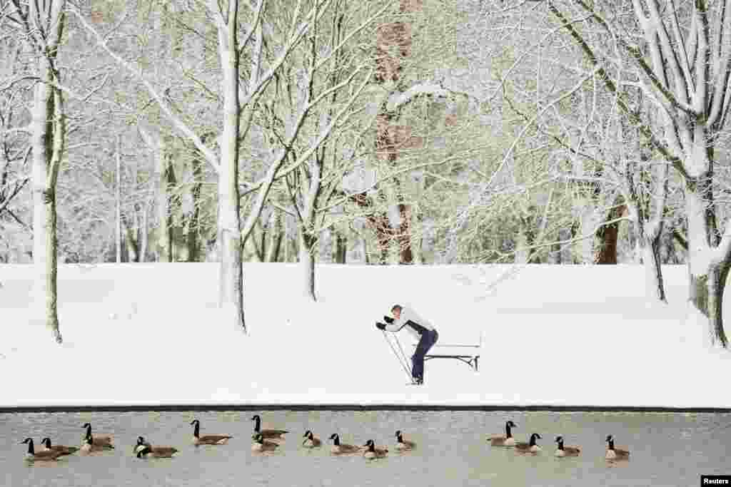 A cross-country skier is seen on the National Mall during heavy snowfall in Washington, Jan. 3, 2022.