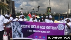 Women demonstrators, including Members of the Kenya Association of Breastfeeding Mothers, hold a protest march in Nairobi, Kenya, May 15, 2018, against a restaurant that allegedly asked a breastfeeding mother to 'Cover up or breastfeed in the toilet."