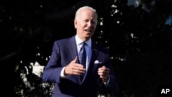 President Joe Biden speaks to reporters on the South Lawn of the White House, Oct. 18, 2021, in Washington.
