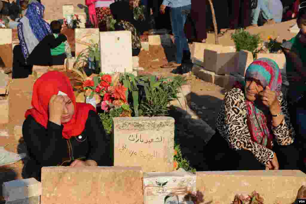 Displaced Afrin people visit the graves of their beloved ones in the eid
