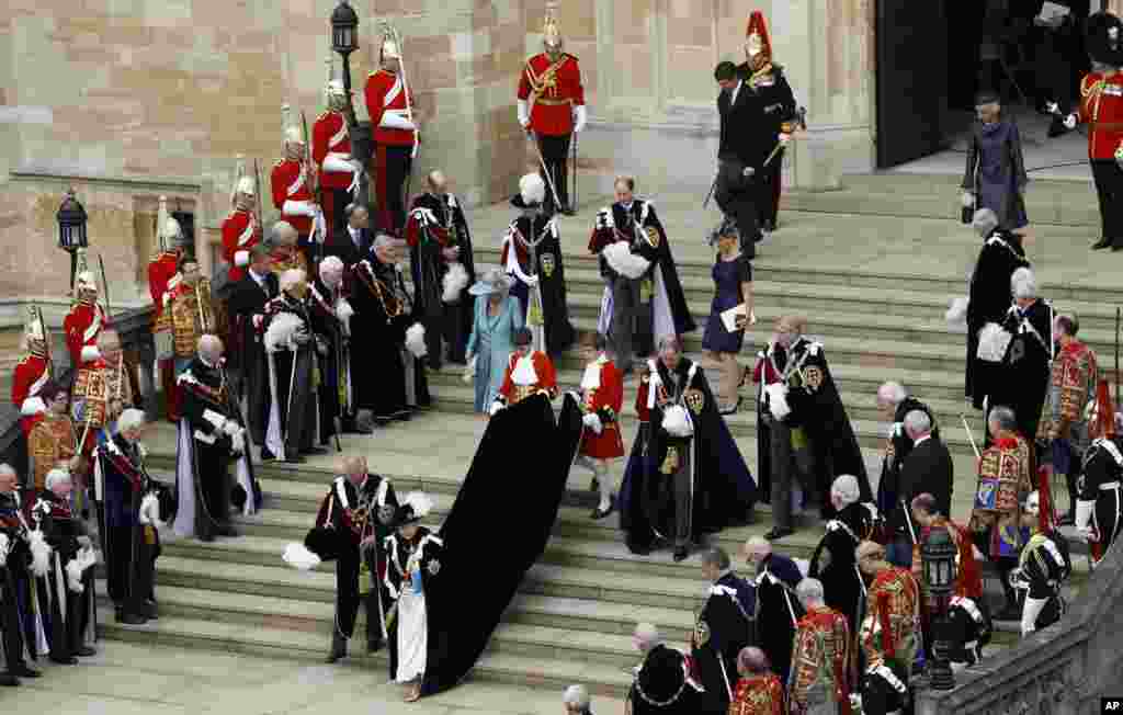 Britain's Queen Elizabeth II and members of the Royal Family leave St George's Chapel after attending the annual Garter Ceremony at Windsor Castle, England.
