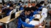 FILE - Students retaking college entrance exams attend class at Deung Yong Moon Boarding School in Kwangju, 40 kilometers (25 miles) southeast of Seoul, Oct. 30, 2012. Operators of the ACT college entrance exam on Saturday canceled the test for all of Sou