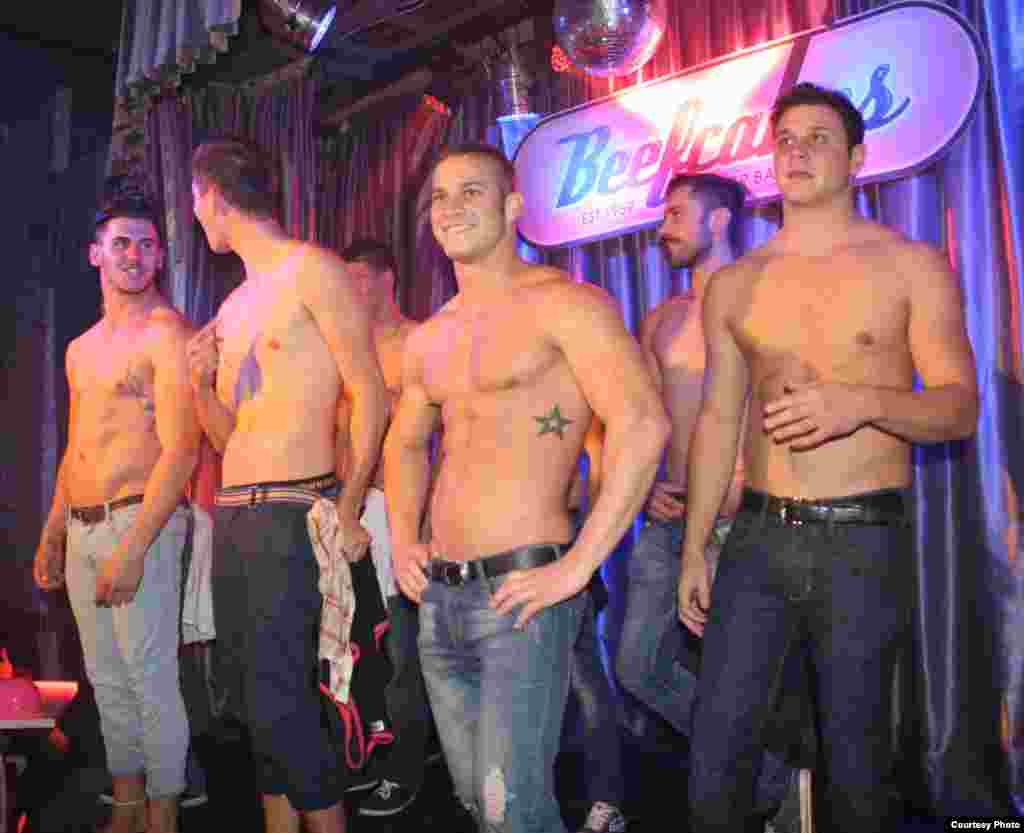 “I’d say seven out of ten clients now are women,” said one of the Beefcakes boys introduced onstage. The club serves Pink Tea cocktails and Greek God hamburgers in a venue modeled after a 1950s Miami burger bar. (Photo by Darren Taylor)