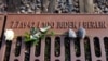 A rose is placed at the Gleis 17 (Platform 17) memorial, a platform at Berlin-Grunewald train station from where Jewish citizens were deported by train to the Nazi concentration camps between 1941 and 1945, in Berlin, Germany, Jan. 27, 2021.