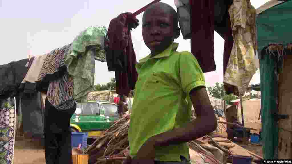 Abubakar Abuba, 12, fled Borno state after a Boko Haram attack. He now lives at the New Kuchogoro camp in Abuja, March 7, 2016. (N. Pinault / VOA)