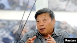 知名紀實攝影師盧廣。