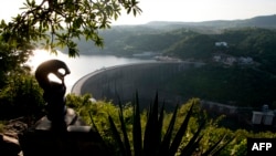 FILE - A general view of the Kariba Dam between Zimbabwe and Zambia, Feb. 19, 2015, on the eve of the signing of $294 million in deals with international investors. Overhaul project will fix deformities and cracks discovered in walls.