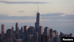 FILE - A passenger boat navigates the Hudson River in front of One World Trade Center in Lower Manhattan in New York, April 17, 2015.