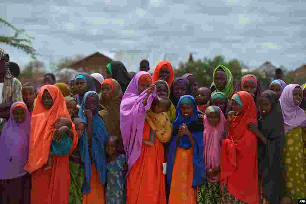 Refugees gather to watch the arrival of United Nations High Commissioner for Refugees Antonio Guterres at the sprawling Dadaab refugee camp in Kenya. The camp currently houses some 350,000 people and for more than 20 years has been home to generations of Somalis who have fled their homeland wracked by conflicts. Kenya's government has asked UNHCR to close the camp after an attack on Kenya’s Garissa University by Somalia-based al-Shabab gunmen in April, whom are suspected to have planned and launched their attack from the camp.