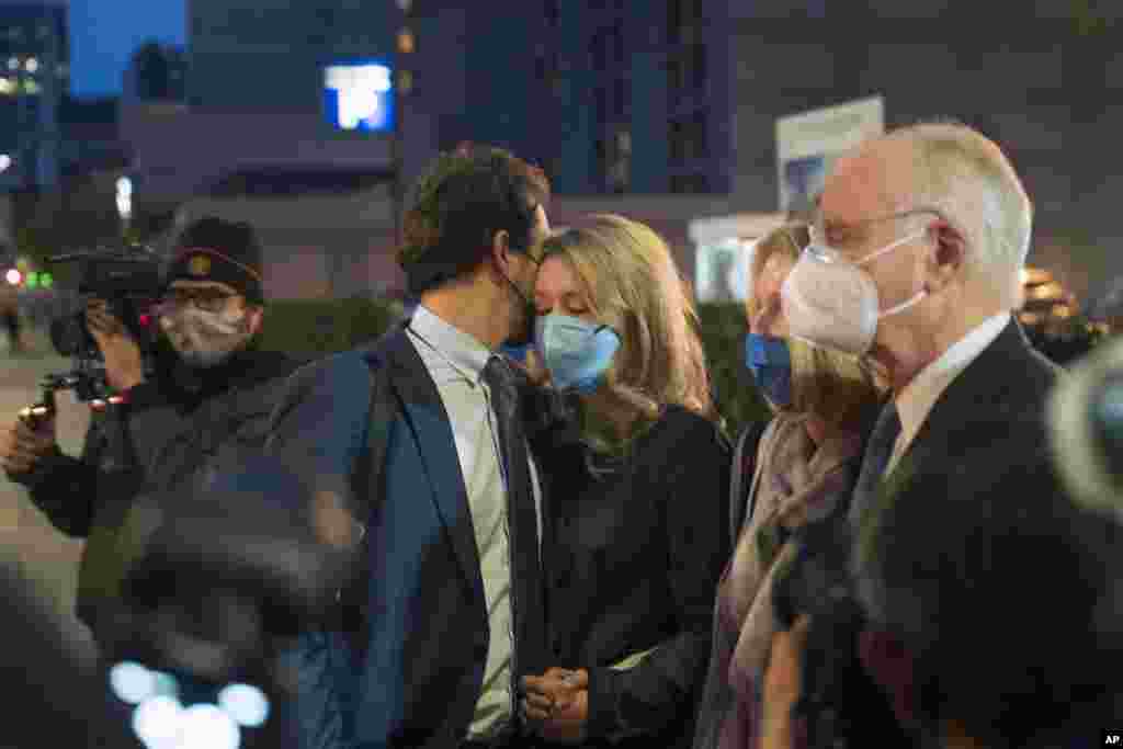 Elizabeth Holmes is consoled by her partner, Billy Evans, after leaving federal court after the verdict in San Jose, California, Jan. 3, 2022. Holmes was convicted of fraud for turning her blood-testing startup Theranos into a sophisticated sham that duped billionaires and other unwitting investors into backing a seemingly revolutionary company whose medical technology never worked as promised. 