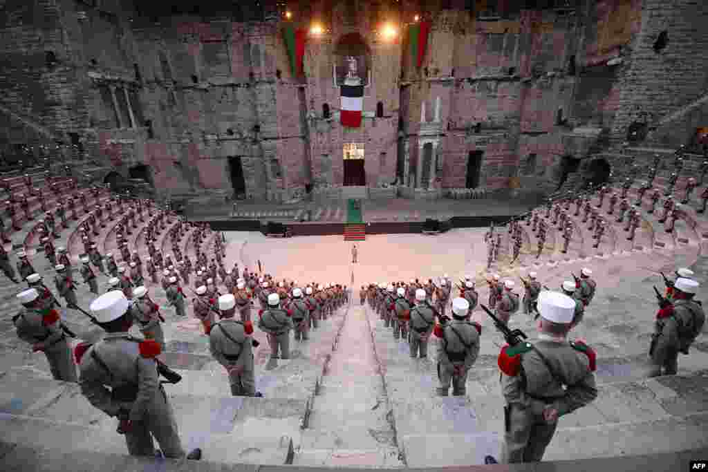 Soldiers of the 1st Foreign Cavalry Regiment of the French Foreign Legion stand guard during the rehearsal of the ceremony in the ancient theater of Orange marking the commemoration of the battle of Camaron, which occurred on 30 April 1863 between the French Foreign Legion and the Mexican army. The ceremony will mark the regiment's last public appearance in Orange before its move to its new base in Carpiagne.