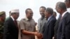 Somali President Mohamed Abdullahi "Farmajo" Mohamed, left, introduces new Prime Minister of Ethiopia Abiy Ahmed, center, to his ministers in Mogadishu, Somalia, June 16, 2018.