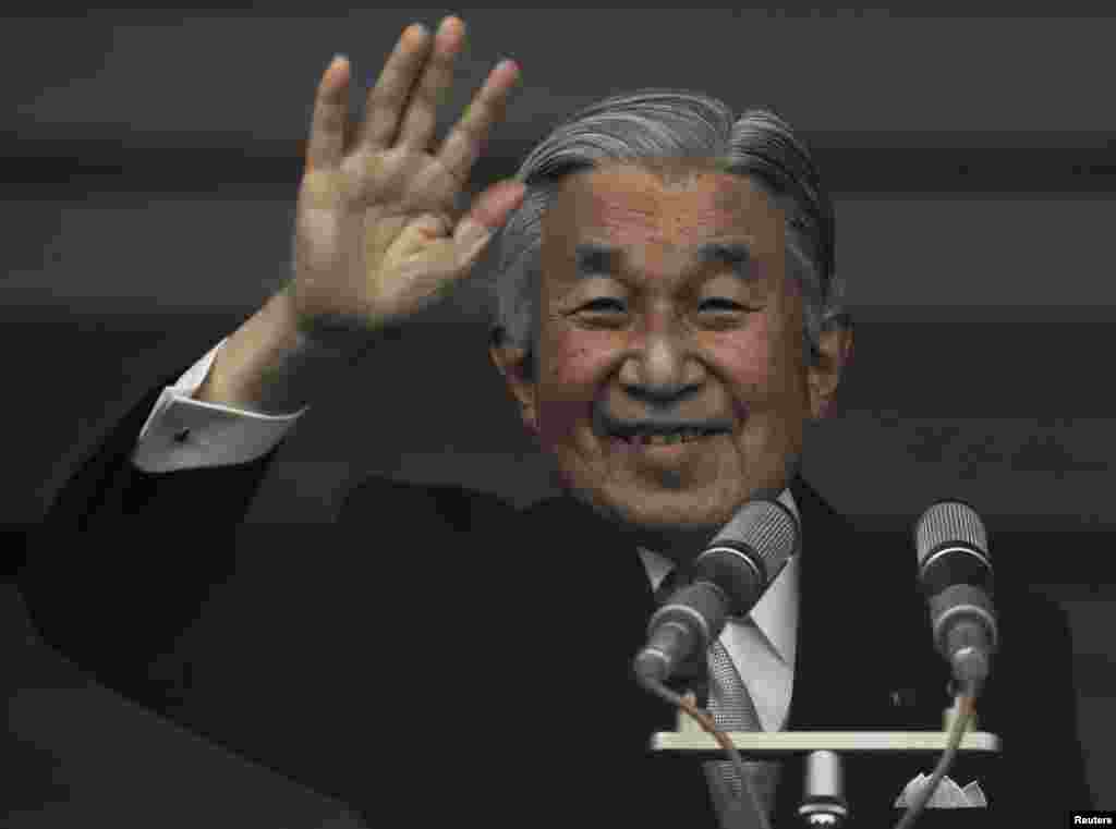 Japan's Emperor Akihito waves to well-wishers who gathered to celebrate his 80th birthday at the Imperial Palace in Tokyo, Dec. 23, 2013. 