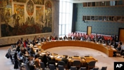 FILE - Members of the U.N. Security Council gather inside the United Nations Security Council chambers in New York, for a meeting on Syria, April 30, 2019.