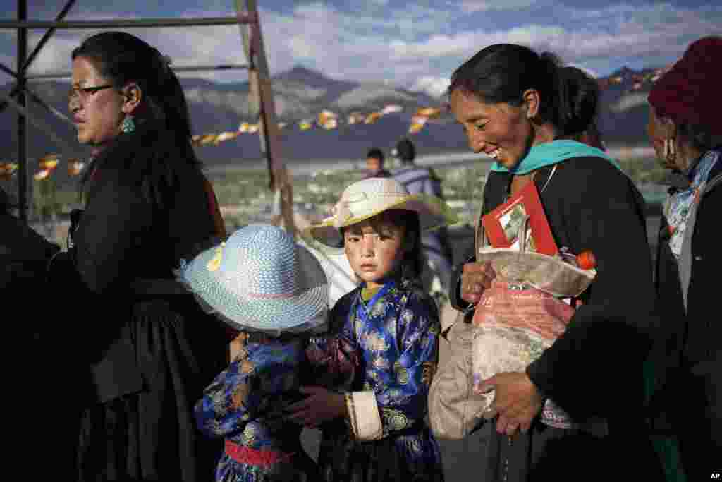 Buddhist devotees wait in line to get inside the venue of the Dalai Lama's teachings on the fifth day of Kalachakra near Leh, India.