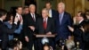 Senate Majority Leader Mitch McConnell of Kentucky, center, calls on a reporter during a news conference with Republican leadership on Capitol Hill in Washington, after President Donald Trump visited the Capitol, Nov. 28, 2017.