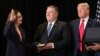 Gina Haspel jure sur la Bible tenue par Mike Pompeo, le secrétaire d'état. Elle est la nouvelle directrice de la CIA. A droite, le président américain Donald Trump assiste à la cérémonie à Langley, le siege de la CIA, le 21 mai 2018. 