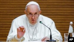 FILE - Pope Francis speaks during a presentation at the Jesuits' General Congregation Hall in Rome, Dec. 13, 2019. 