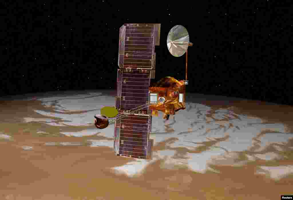 NASA's Mars Odyssey spacecraft passes above Mars' south pole in this artist's concept illustration.