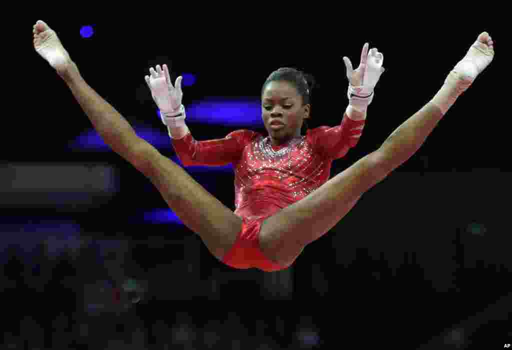U.S. gymnast Gabrielle Douglas perfroms on the uneven bars during the Artistic Gymnastics women's team final at the 2012 Summer Olympics, July 31, 2012, in London.