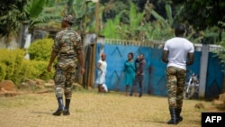 FILE - Government soldiers are seen on patrol in Bafut, in the restive northwest English-speaking region of Cameroon, Nov. 15, 2017.