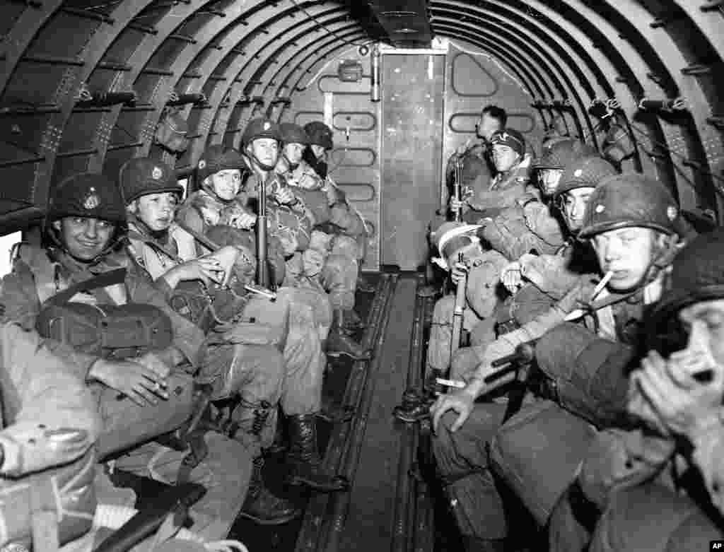 American paratroopers fly over the English Channel enroute to a 100-mile front during the invasion of the Normandy coast, France, June 6, 1944.