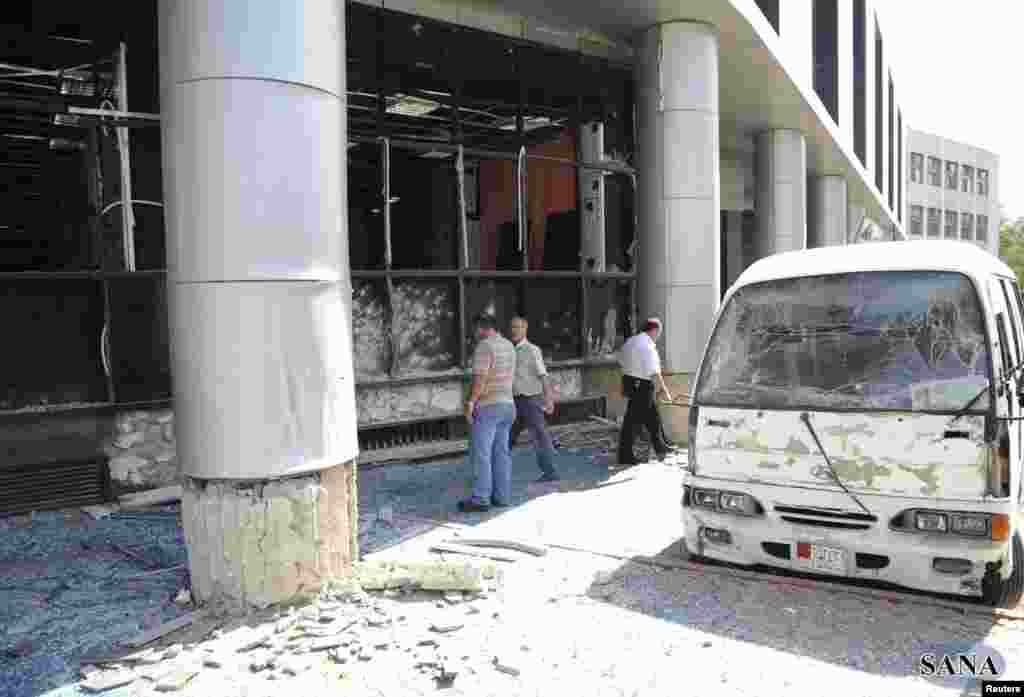 A photo from Syria's national news agency SANA shows the wreckage of a bus after a bomb exploded in al-Zablatani, in Damascus, Syria, October 9, 2012.